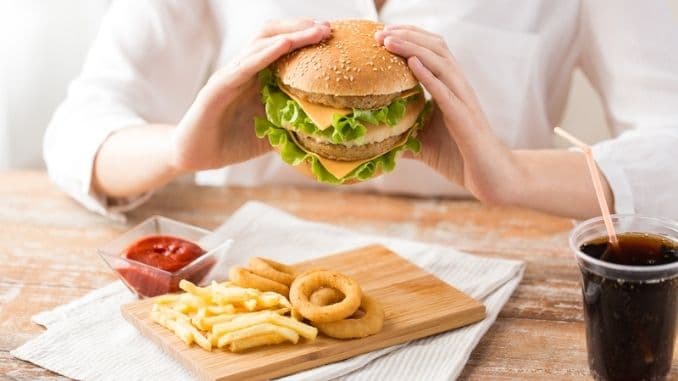 woman eating hamburger