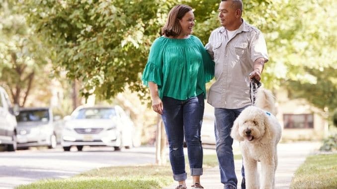 Couple Walking Dog