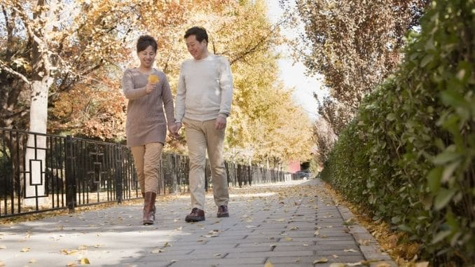 couple-talking-walk-park