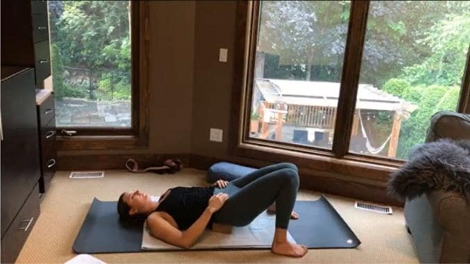 Supported Bridge- Bed Yoga Poses for Low Back Pain