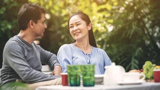 couple-talking-dinner-backyard