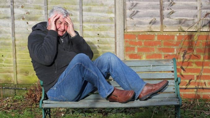 panic attack man bench sitting his feet