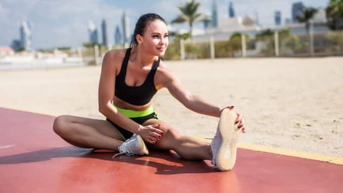 Fitness Woman Stretching Legs - Tight Hamstrings