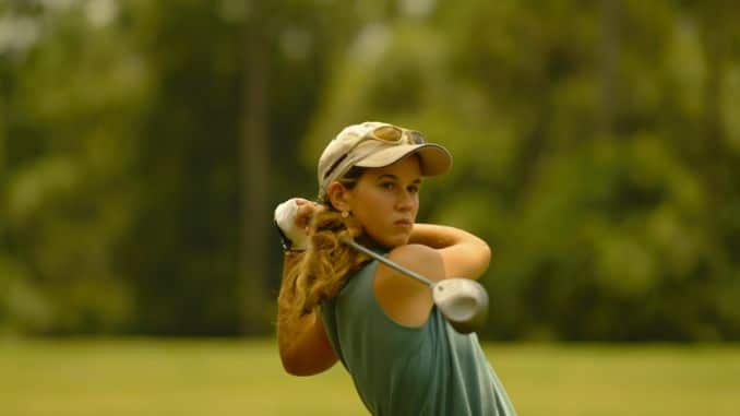 woman playing golf