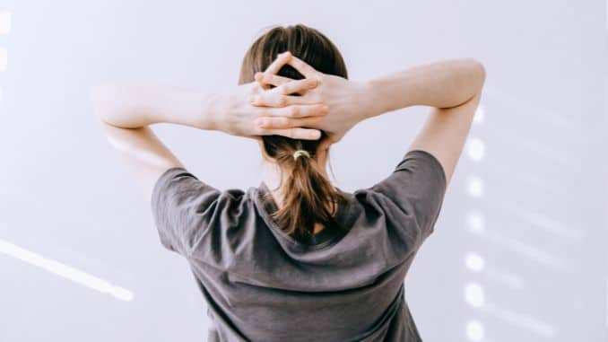 woman doing neck stretch